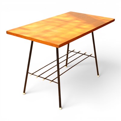 Lot 565 - A mid century teak coffee table on black metal...