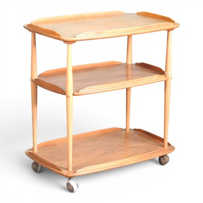 Lot 30 - A 1970s Ercol light elm hostess trolley, with...