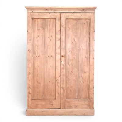 Lot 224 - A reclaimed pine double wardrobe, on a plinth...
