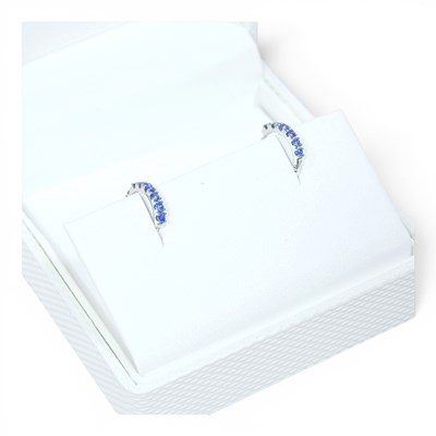 Lot 48 - A pair of modern 9 carat white gold sapphire...