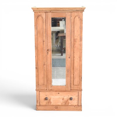 Lot 302 - A reclaimed pine single wardrobe, enclosed by...