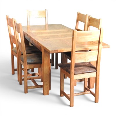 Lot 232 - A modern light oak extending dining table,...