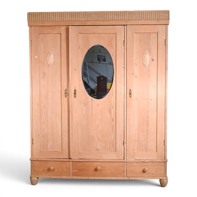 Lot 683 - A mid 20th century continental triple armoire,...