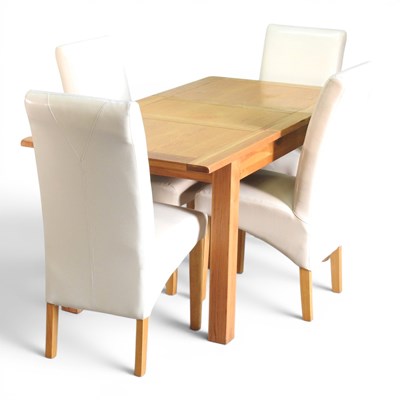 Lot 649 - A modern oak extending dining table, with an...
