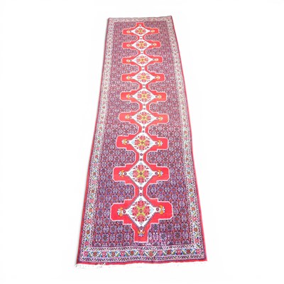 Lot 259 - A Persian senneh runner, with a row of nine...