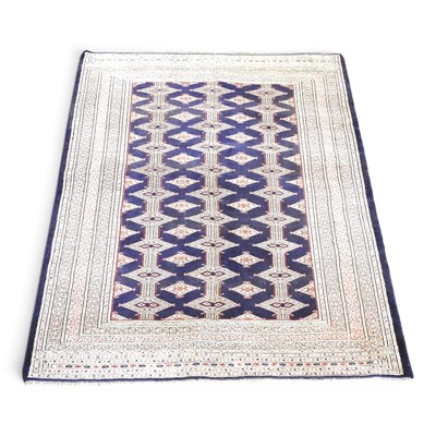 Lot 377 - A Persian turkoman rug, with rows of blue...