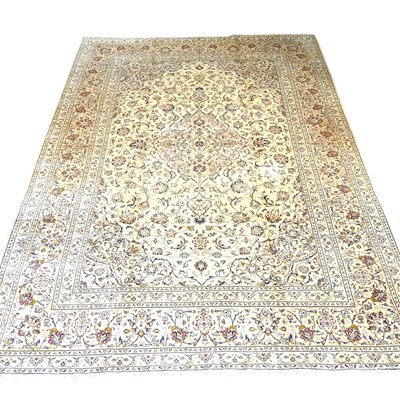 Lot 353 - A Persian kashan carpet, with scrolling...