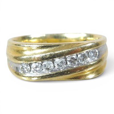 Lot 1 - A 14 carat gold diamond ring, set with a band...