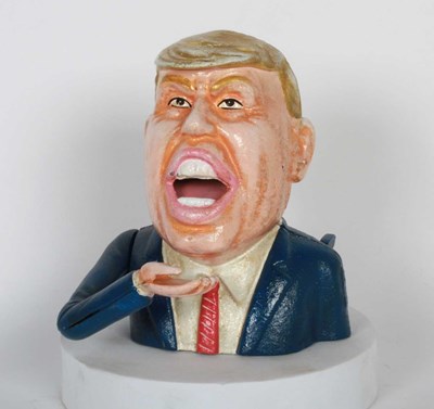Lot 928 - A painted cast iron novelty money box in the...