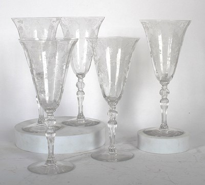 Lot 891 - A set of five etched wine glasses