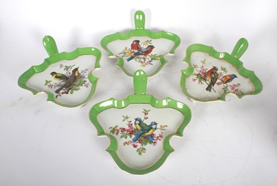 Lot 153 - A set of four porcelain dishes, each decorated...