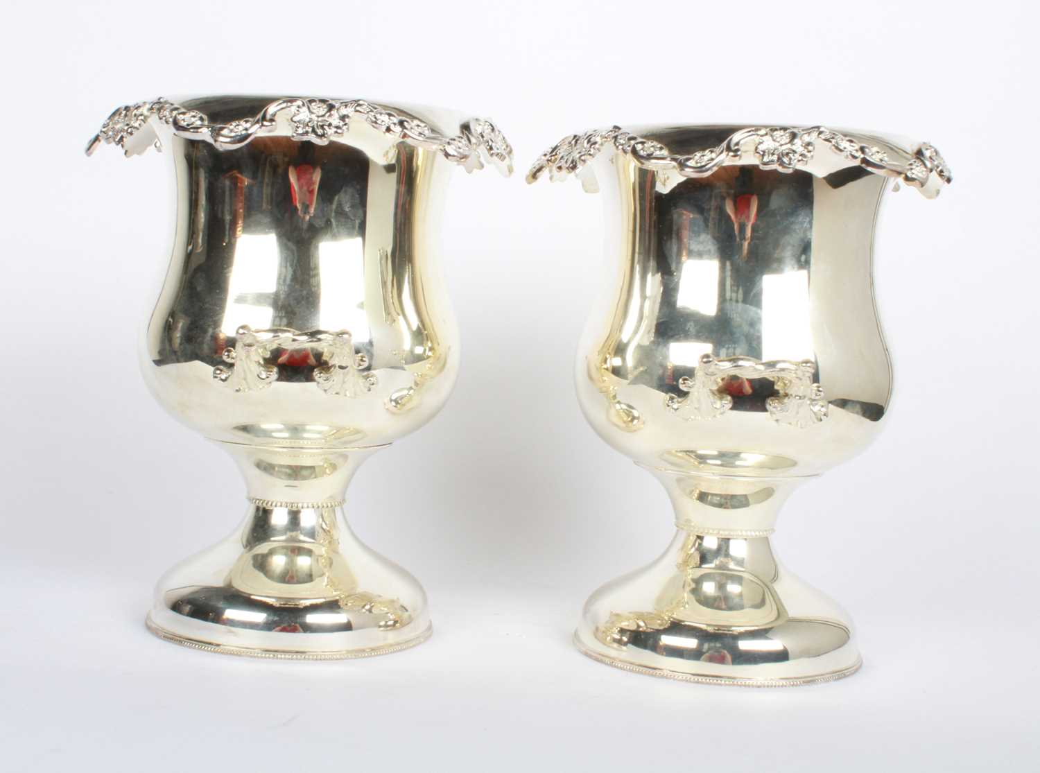 Lot 46 - A pair of silver plated wine coolers, each in...