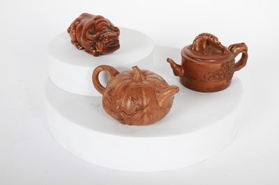 Lot 101 - A Japanese carved wood netsuke, together with...