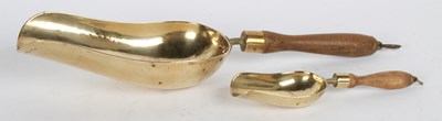 Lot 704 - Two vintage brass grain scoops