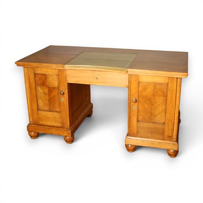 Lot 613 - An oak pedestal desk, having a green gilt...