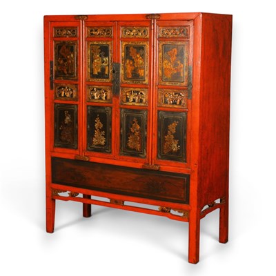 Lot 452 - A Chinese red lacquered cabinet with gilded...