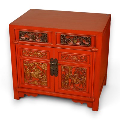 Lot 503 - A Chinese red lacquer cabinet with gilded...