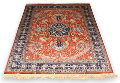 Lot 493 - A Persian red and blue wool rug, having a...