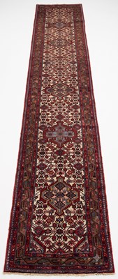 Lot 595 - A Persian Hamadan runner rug, with six...