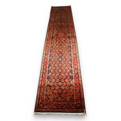 Lot 594 - A Persian Hamadan runner rug, having a blue...