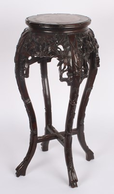 Lot 604 - A Chinese hardwood jardiniere stand with red...