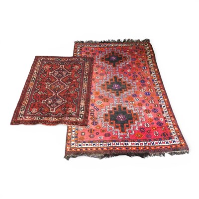 Lot 499 - An Afghan rug, with three central hooked...