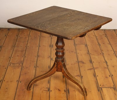 Lot 575 - A 19th century oak tilt top tripod occasional...