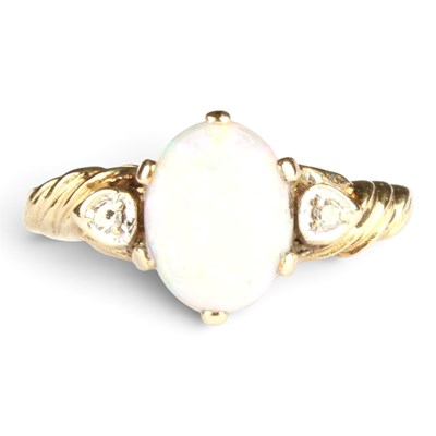 Lot 358 - A 9 carat yellow gold opal and diamond three...