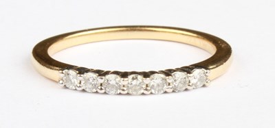 Lot 56 - A 14 carat yellow gold diamond half hoop...