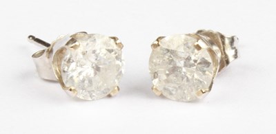 Lot 28 - A pair of diamond stud earrings, approximately...