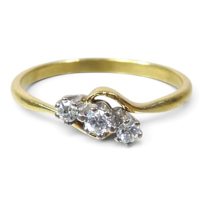 Lot 81 - An 18 carat gold three stone diamond ring, of...