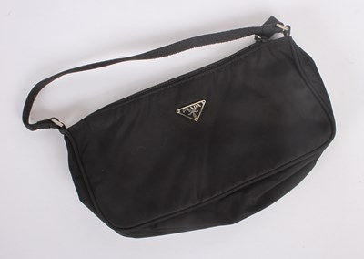 Lot 38 - A Prada black canvas purse, with a webbing handle