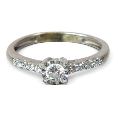 Lot 64 - A 9 carat white gold illusion set diamond ring,...