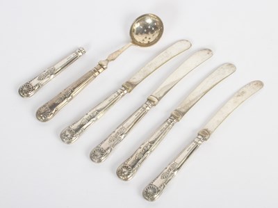 Lot 32 - A set of four silver handled butter knives,...