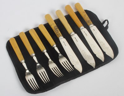 Lot 64 - A set of eight Edward VII silver fish knives...