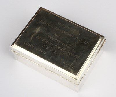 Lot 74 - A silver clad table cigarette box, bearing a...