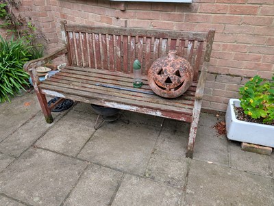 Lot 790 - A teak garden bench
