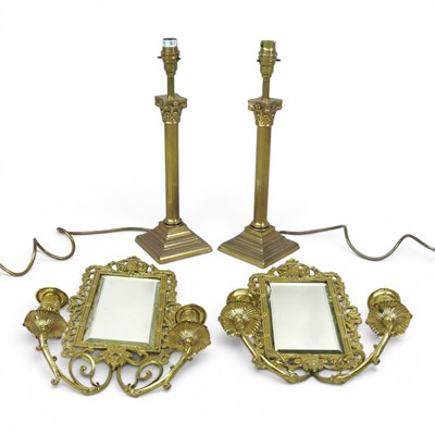 Lot 328 - A pair of ornate brass framed girandole, each...
