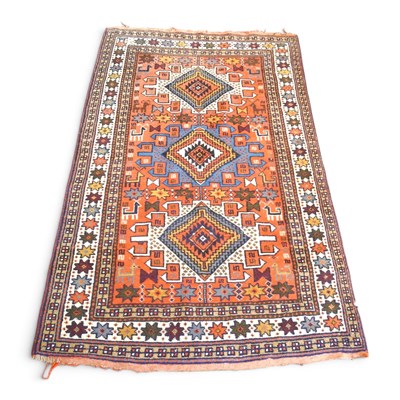Lot 180 - A Persian rug, with three central lozenges,...
