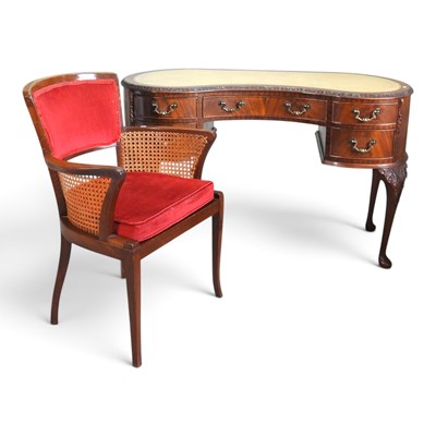 Lot 679 - A 1930s kidney shaped desk, on cabriole legs,...
