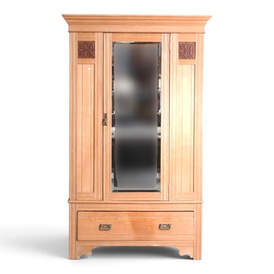 Lot 681 - An Edwardian ash single wardrobe, enclosed by...