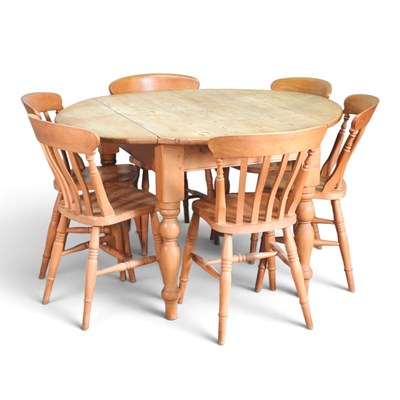 Lot 658 - A modern pine drop leaf dining table, 130cm...