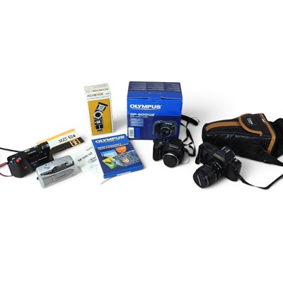 Lot 284 - A Canon T50 camera, together with an Olympus...