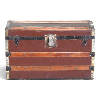 Lot 497 - An early 20th century wooden bound dome top trunk