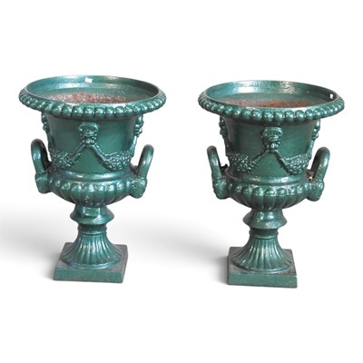 Lot 44 - A pair of green painted cast iron garden urns,...