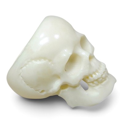 Lot 231 - A carved bone ring, in the form of a skull,...