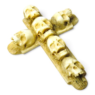 Lot 608 - A carved bone memento mori crucifix, decorated...