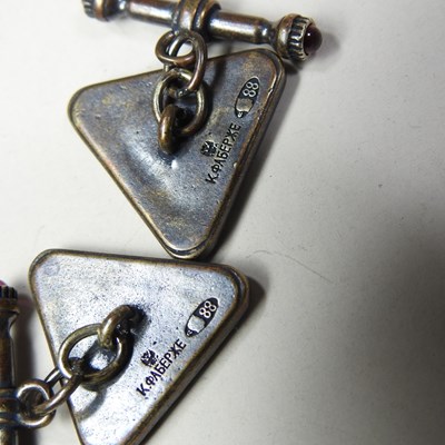 Lot 45 - A pair of Russian style white metal and red...