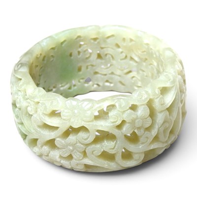 Lot 42 - A Chinese carved celadon jade coloured stone...