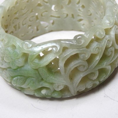 Lot 42 - A Chinese carved celadon jade coloured stone...